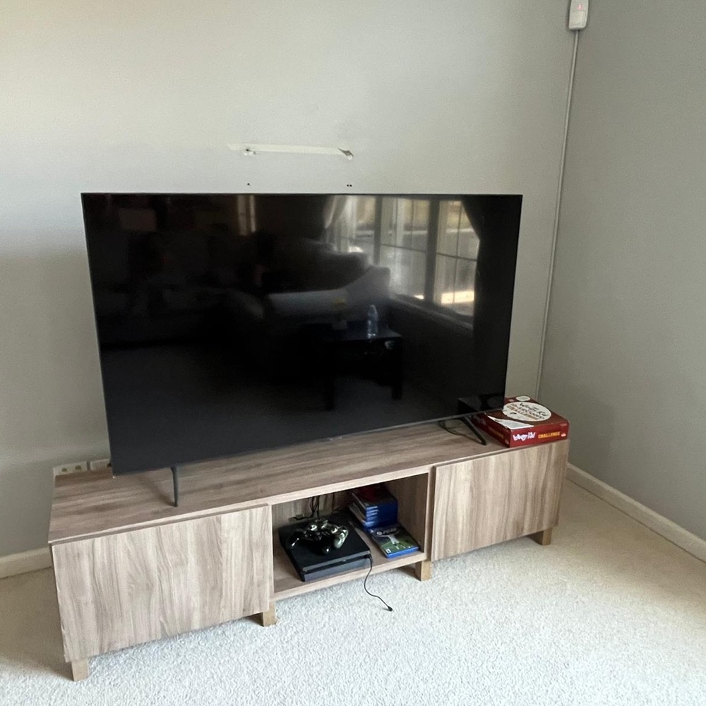 Modern Black Flat Screen TV with Stand